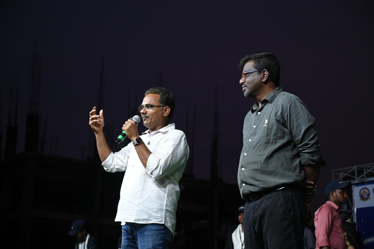 A winning team celebrating on stage.